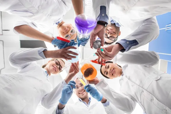 low-angle-view-of-scientists-holding-various-test-2026-01-06-00-29-47-utc-697b75df8d825