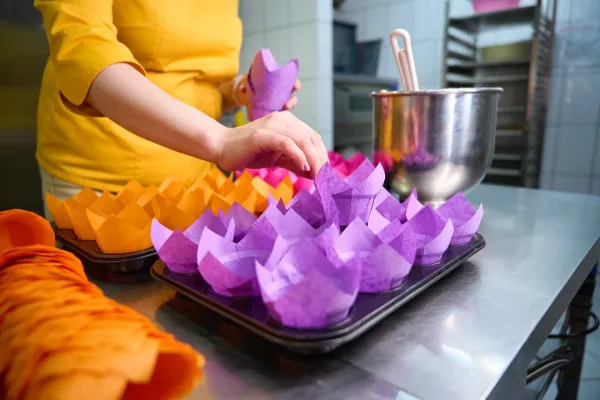 qualified-pastry-chef-arranging-disposable-cake-mo-2026-01-08-07-39-10-utc-697b75caa80cd